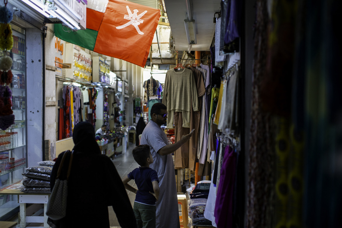 visitors-browse-goods-for-sale-at-the-al-seeb-souq-in-muscat-oman